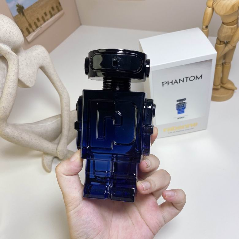 Rabanne Phantom Intense 100ml deep blue robot bottle front view in hand